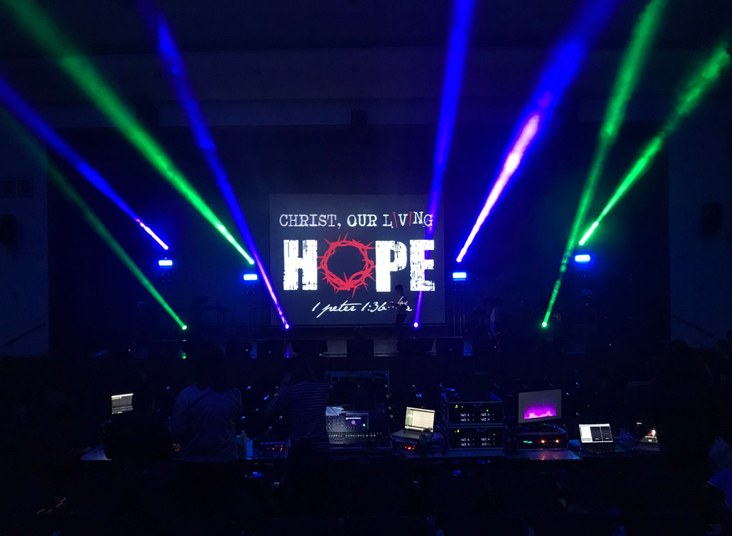 Concert stage with beam lighting at a youth concert